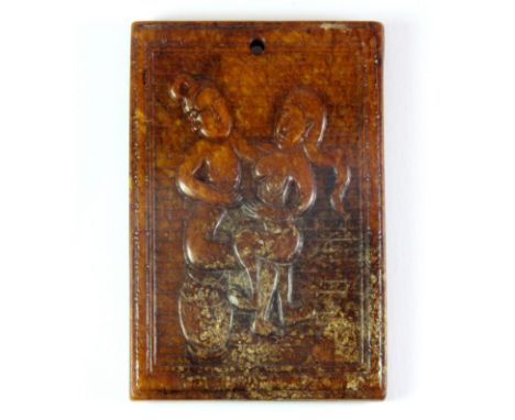 A Chinese carved amber colour jade/hardstone erotic double sided amulet. Size 8.5x5.8cms