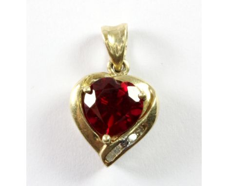 A 9ct yellow gold (stamped 375) heart shaped pendant set with a heart cut ruby and diamonds, L. 1.6cm.
