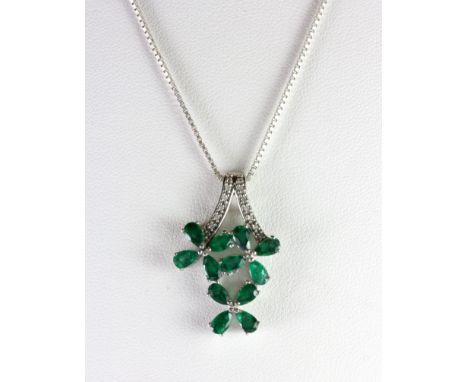 A 925 silver emerald and diamond pendant and chain.