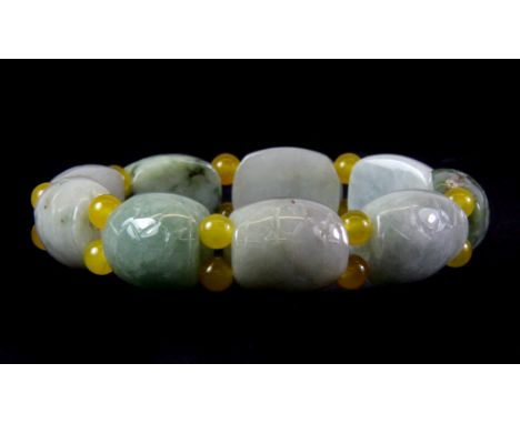 A Chinese carved jade bracelet, each main bead in the form of a tortoise shell.