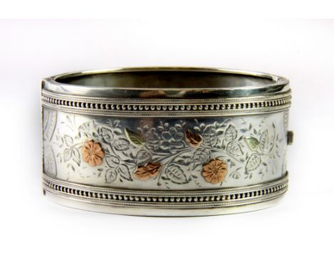 A hallmarked silver gilt bangle, L. 6.8cm.