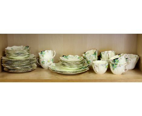An extensive 1930's Paragon part tea service comprising 2 sandwich plates, 12 side plates, 12 saucers, 9 cups and a sugar bow