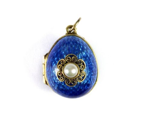 A lovely Russian 925 silver gilt and enamel miniature Faberge egg style pendant set with a pearl, L. 2.5cm.