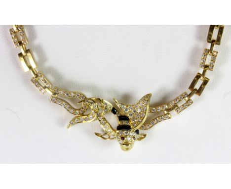 An 18ct yellow gold (stamped 750) and enamel chain necklace on the shape of a fish set with diamonds and rubies (approx. 27.6