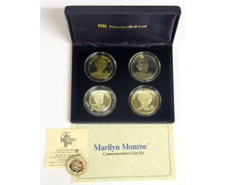 A cased set of Marilyn Monroe 50 dollar to 5 dollar commemorative coins and a Marilyn Monroe magic design pendant.