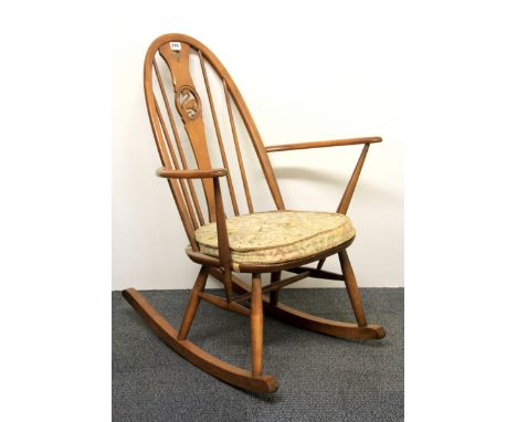 An Ercol swan backed rocking chair.