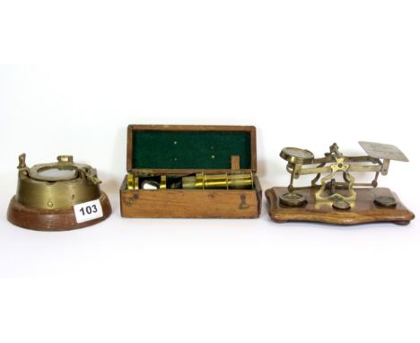 An early brass postal scale, an cased microscope and a porthole ashtray.