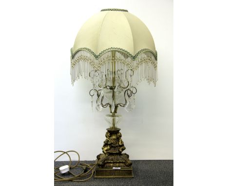 An impressive gilt brass and crystal table lamp with beaded shade, H. 83cm.