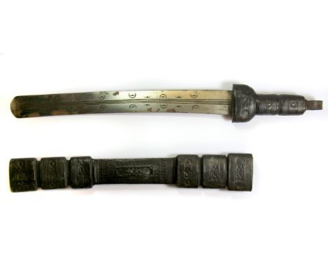 An eastern sword with decorated steel blade and embossed leather hilt and scabbard, L. 58cm.