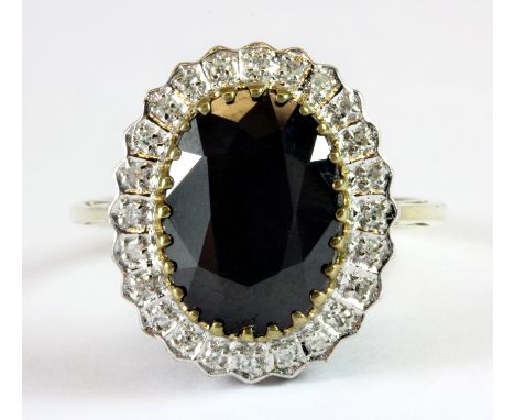 A 9ct yellow gold sapphire and diamond cluster ring (T.5).