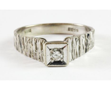 An 18ct white gold diamond set solitaire ring (O.5).