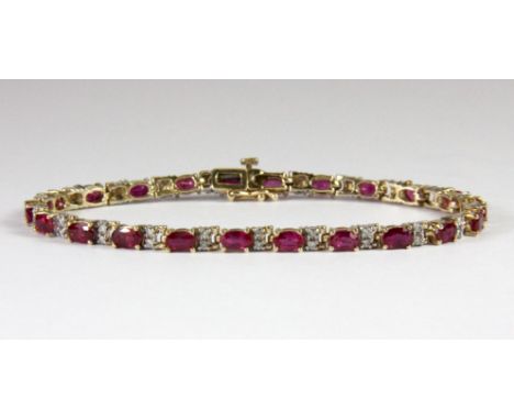 A lovely 9ct yellow gold ruby and diamond set tennis bracelet, L. 19cm.