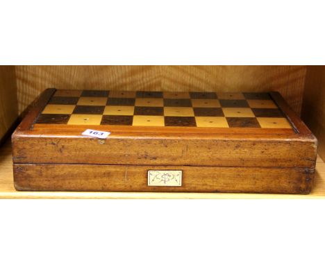 A 19th century inlaid mixed wood games box for chess, draughts and backgammon. Box size 45 x 26 x 9cm.