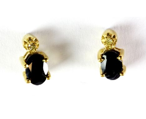 A pair of yellow metal (tested minimum 9ct gold) sapphire and diamond stud earrings.
