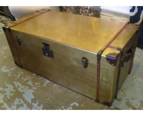 TRUNK, gold coloured with a rectangular rising top enclosing space for storage and a handle to each side, 100cm W x 42cm H x 