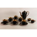 A 15 Piece Wade coffee set in black with gold painted interior. These items form part the collection