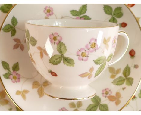 A collection of Wedgwood Wild Strawberry tea and dinner ware to include - 6 trios, sugar bowl, milk jug, salt &amp; pepper po