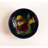 Moorcroft small bowl in the Orchid pattern on blue ground. Impressed Moorcroft Made In England to