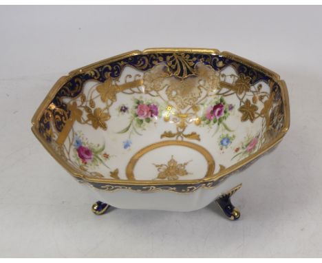 A Noritake Three Footed Bowl. Heavily gilt with handpainted floral sprays. Diameter: 17.6cm 