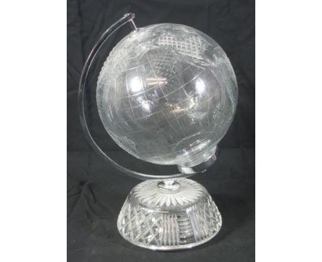 UNUSUAL WATERFORD LEAD CRYSTAL SMALL WORLD GLOBE OF THE YEAR turning on its plated axis and standing on a cut glass tapering 