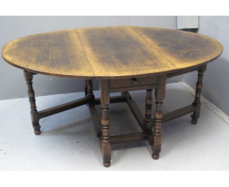 18TH CENTURY STYLE OAK GATE LEGGED TABLE probably by Gwilym C Price Lampeter (unmarked), having central pull out drawers, sta