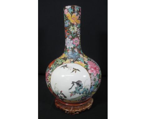 GOOD QUALITY CHINESE PORCELAIN BOTTLE VASE, with three circular cartouches depicting a squirrel on a vine, three ducks in fli