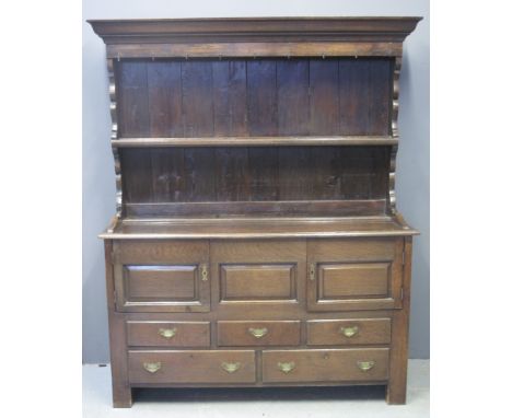 18TH CENTURY WELSH OAK COFFER now converted into a rack back dresser, having moulded cornice with iron hooks and single shelf