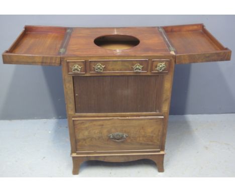 19TH CENTURY MAHOGANY COMMODE WASHSTAND having two folding hinged lids, the interior revealing an associated metal jug above 