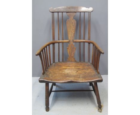 19TH CENTURY ASH, ELM AND MIXED WOODS SPLAT AND STICK BACKED FIRESIDE ARMCHAIR with wide moulded seat on turned legs. (B.P. 2