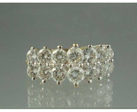 A 14CT GOLD AND DIAMOND CHEVRON CLUSTER RING of fourteen diamonds. Ring size K & 1/2, weight 4g approx. (B.P. 24% incl. VAT) 