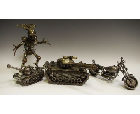 A steam punk model of a tank, another smaller; a steam punk model of a motorbike and alien 