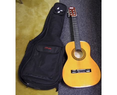 A Stagg C530 six string acoustic guitar, carrying bag 