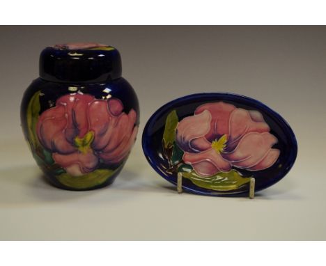 A Moorcroft magnolia pattern ginger jar and cover, tube lined; a conforming trinket tray (2)