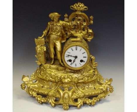 An Ormulu grape/farmer boy Mantel clock, enamel dial, Roman numerals. 