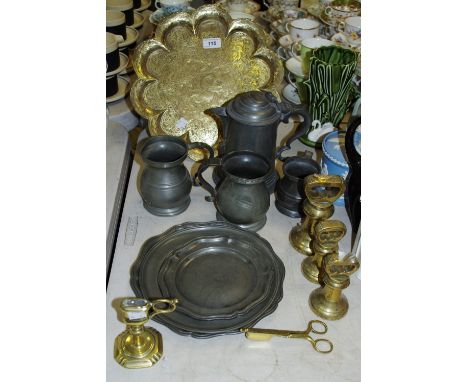 Metalware - an early 19th century pewter flagon tankard, others, waisted, plates, etc; a brass taper stick and snuffers (3)