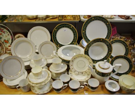A German Kahla pattern dinner setting, decorative green and gilded borders, conforming coffee pot and four cups and saucers; 
