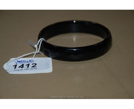 A faceted Onyx Bangle