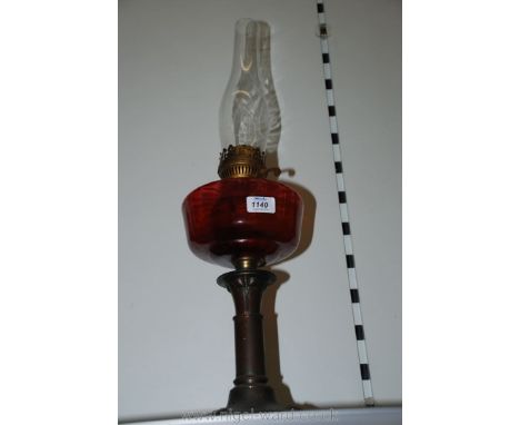 An Arts and Crafts Cranberry oil Lamp