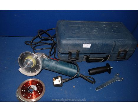 A plastic cased Bosch GWS 8-115c Angle Grinder and three various discs.
