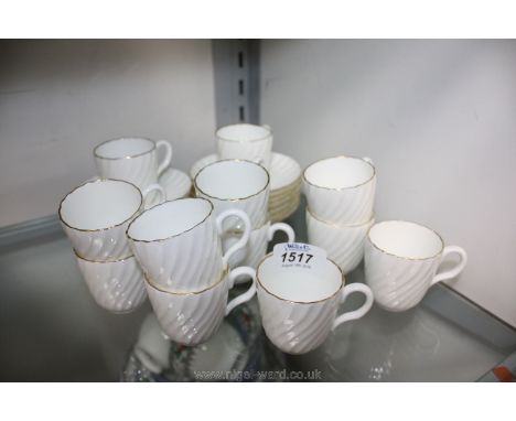 Twelve miniature white and gold Mintons Coffee Cups and saucers (one saucer with chip, cracked cup, etc)