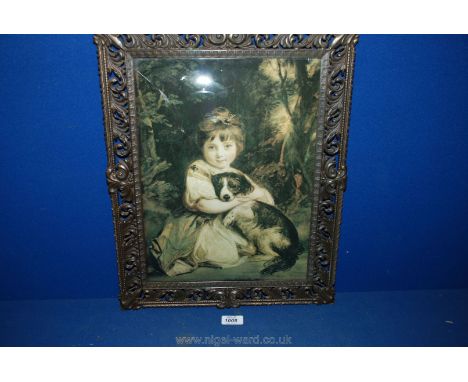 A Print of a Girl cuddling her dog, glazed in a metal frame.
