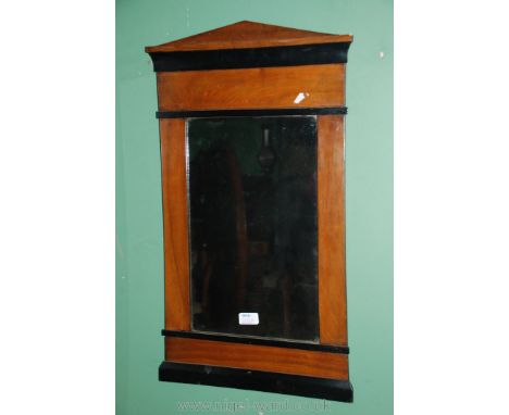 A Palladian style Walnut and ebonised finish wall hanging Mirror, 27 1/2'' x 15 3/4''
