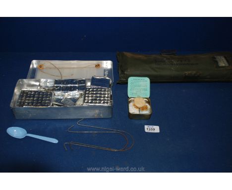 An individual Army issue Protection Kit (unopened), boxed survival kit for when water is scarce and a tin of sterilizing tabl