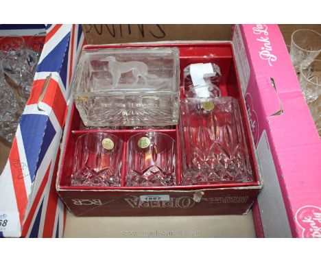 A boxed set of six crystal Glasses and a decanter together with a butter dish with Red Setter picture