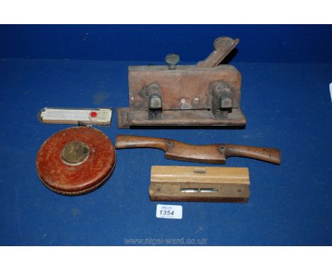 A small quantity of wooden tools including a plane, leather measuring tape, Spoke shave plane, two small spirit levels etc.
