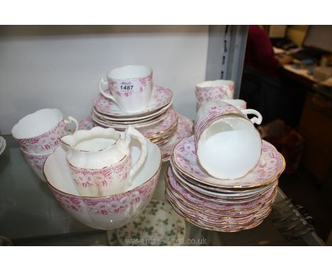 An antique Wileman/Shelley ''Daisy'' pattern Teaset in pink comprising ten saucers, twelve tea plates, two large plates, milk