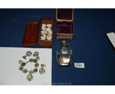 A small wooden box with miscellaneous mother of pearl buttons, miniature ivory handled corkscrew, hip flask, coin bracelet, e