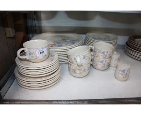 A Poole 'Springtime' pattern part Dinner service including ten dinner plates, saucers, plates and cups, etc