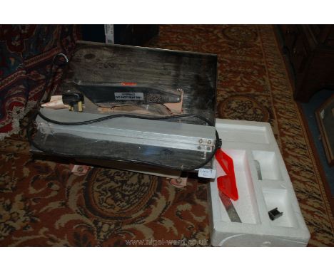 A boxed Clarke 33mm Electric Tile Cutter and Table