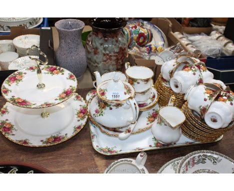 A Royal Albert Old Country Roses part teaset including eleven cups, twelve saucers, fourteen plates, teapot, a two tiered cak